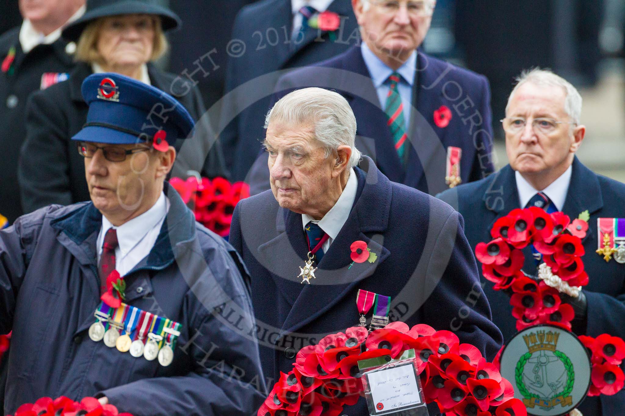 Remembrance Sunday at the Cenotaph 2015: On the way to the Cenotaph to lay their wreaths: Eric Reeve for Transport for London, Air Vice-Marshal David Whitaker for the Royal Air Force Association, Christopher Dovey for the Royal Navy Association, and Jan Harvey for Royal British Legion Scotland. Image #339, 08 November 2015 11:25 Whitehall, London, UK