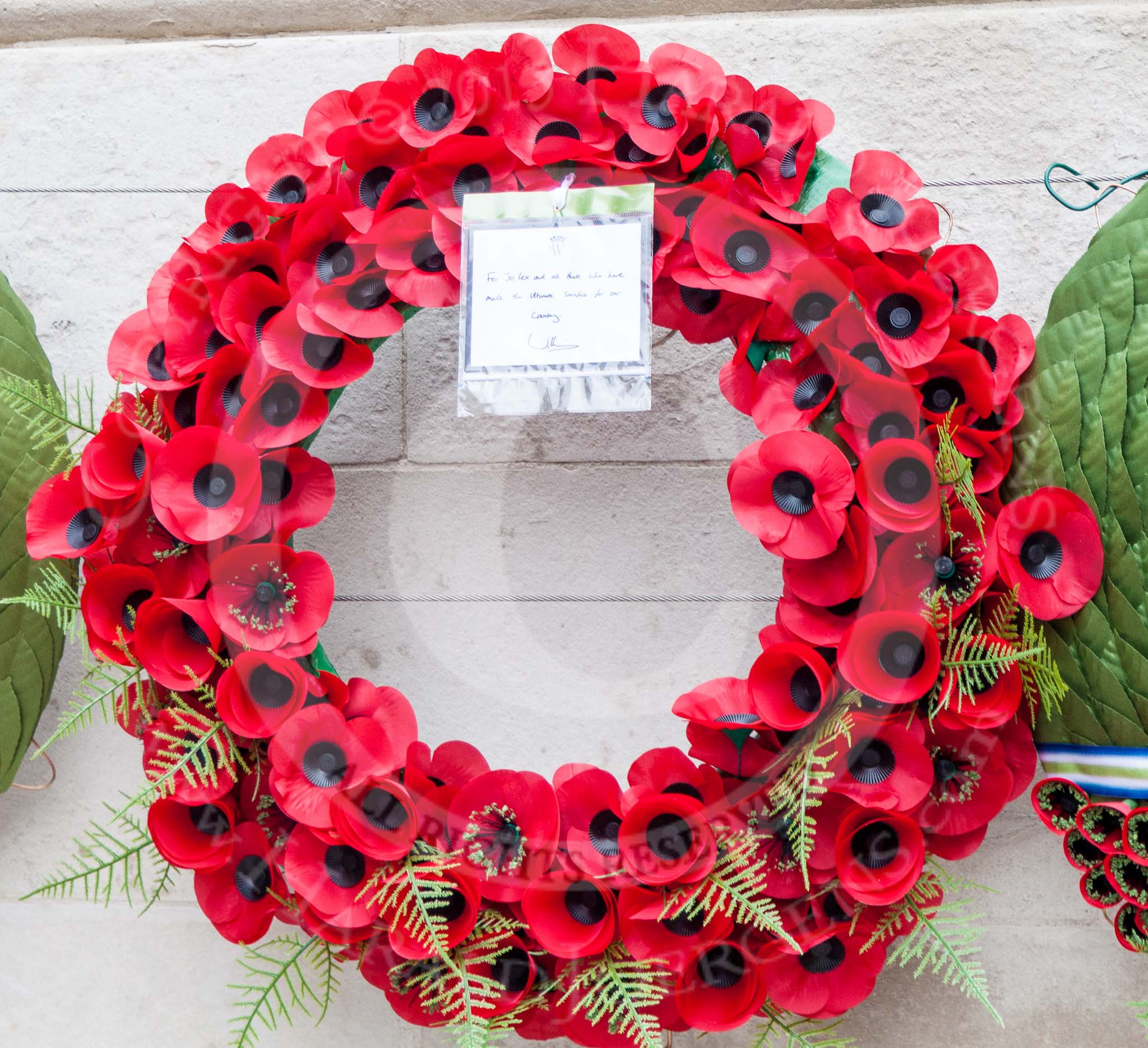 Remembrance Sunday at the Cenotaph 2015: The wreath laid by Prince William.
"For Jo, Lex(?) and all those that have made the Ultimate Sacrifice for our Country". Image #378, 08 November 2015 12:44 Whitehall, London, UK