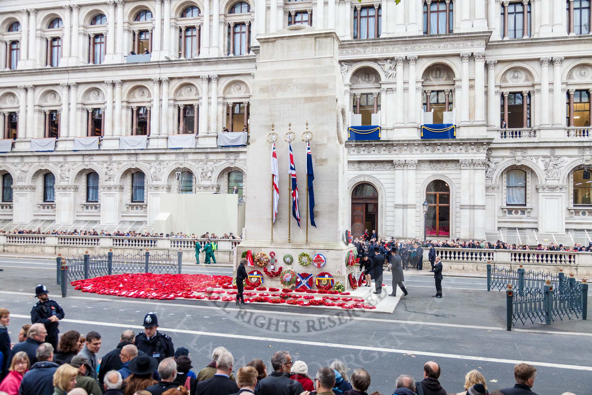 Remembrance Sunday at the Cenotaph 2015: After the event. The wreaths have been repositioned and  the fencing around the Cenotaph is set up. Image #379, 08 November 2015 12:54 Whitehall, London, UK