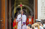 Remembrance Sunday at the Cenotaph 2015: The choir, led by the Cross Bearer, Jason Panagiotopoulos, is emerging from the Foreign- and Commonwealth Office Building, followed by the 10 Children of the Chapel Royal. Image #73, 08 November 2015 10:53 Whitehall, London, UK