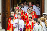 Remembrance Sunday at the Cenotaph 2015: The choir, led by the Cross Bearer, Jason Panagiotopoulos, is emerging from the Foreign- and Commonwealth Office Building. Behind them the 6 Gentlemen-in-Ordinary. Image #75, 08 November 2015 10:53 Whitehall, London, UK