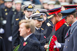 Remembrance Sunday at the Cenotaph 2015: The Equerry to HRH The Duke of Cambridge,  Lieutenant  Commander  James  Benbow, Royal Navy, handing over the wreath to Prince William. Behind them, Captain  Edward  Lane  Fox, Equerry to HRH Prince Henry of Wales, is handing over the wreath to Prince Harry. Image #190, 08 November 2015 11:05 Whitehall, London, UK