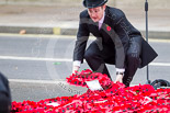 Remembrance Sunday at the Cenotaph 2015: The wreaths at the Cenotaph are re-arranged before the barriers go up and the public is allowed to get close. Image #373, 08 November 2015 12:39 Whitehall, London, UK