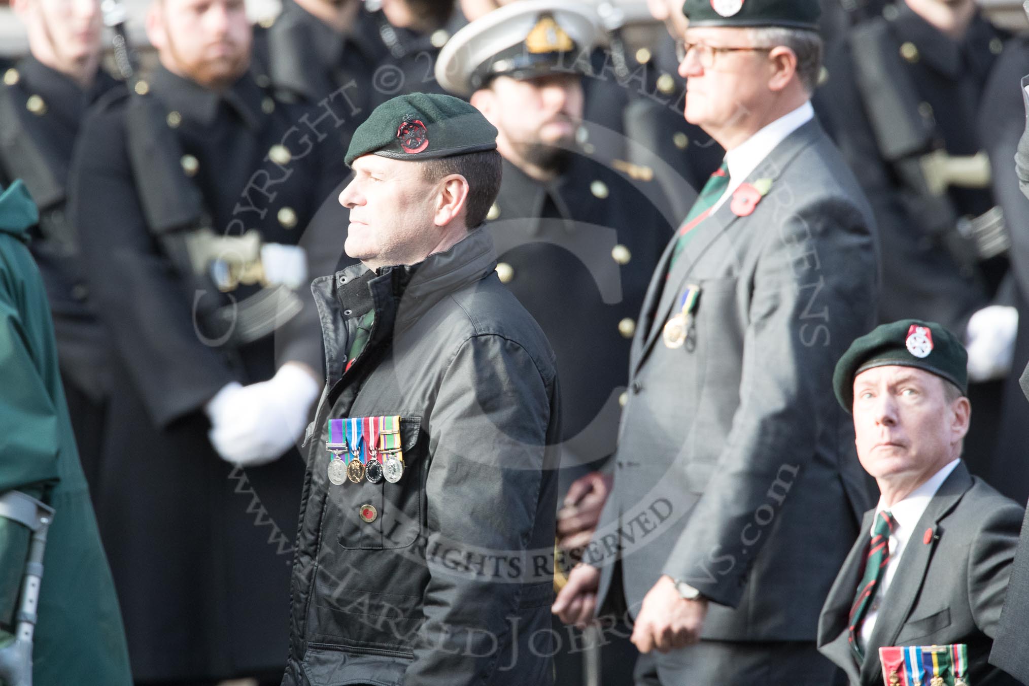 Royal Green Jackets (Group A2, 153 members) during the Royal British Legion March Past on Remembrance Sunday at the Cenotaph, Whitehall, Westminster, London, 11 November 2018, 11:55. On the right: BBC security correspondent Frank Gardner, who served with the Royal Green Jackets from 1984 to 2006.