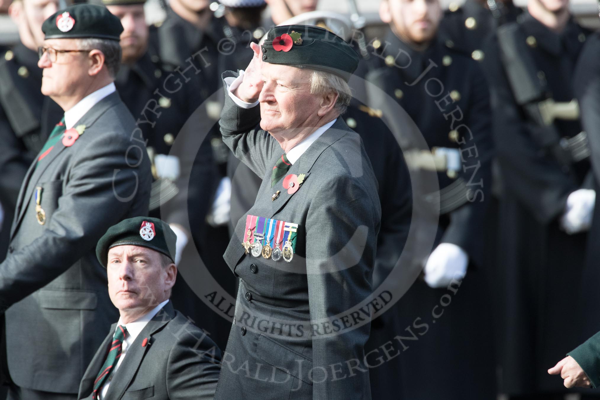 Royal Green Jackets (Group A2, 153 members) during the Royal British Legion March Past on Remembrance Sunday at the Cenotaph, Whitehall, Westminster, London, 11 November 2018, 11:55. On the left: BBC security correspondent Frank Gardner, who served with the Royal Green Jackets from 1984 to 2006.
