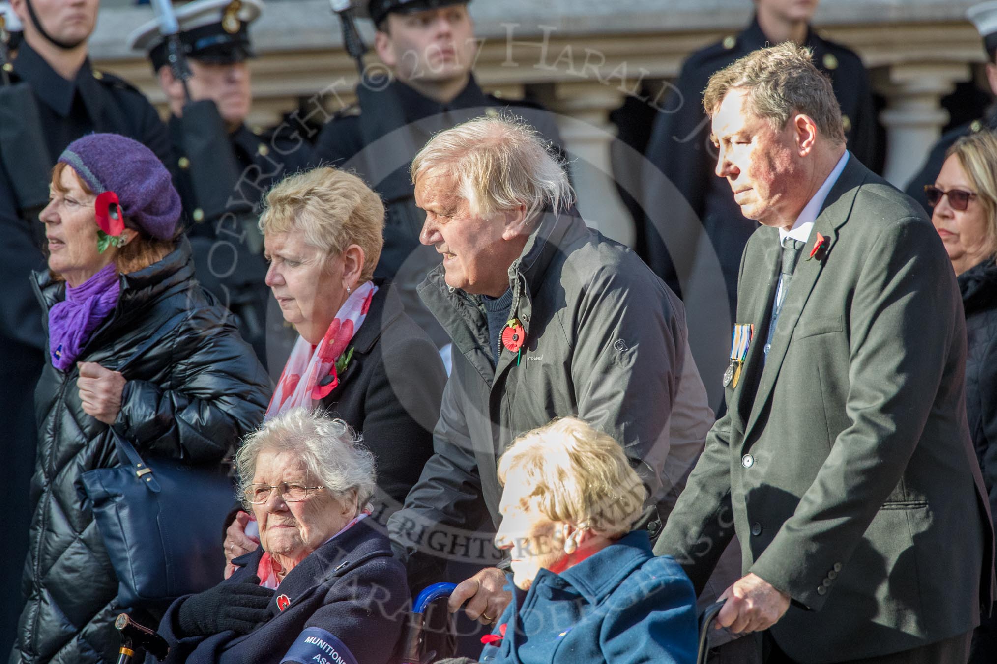 Munitions Workers Association (Group M3, 21 members) during the Royal British Legion March Past on Remembrance Sunday at the Cenotaph, Whitehall, Westminster, London, 11 November 2018, 12:25.