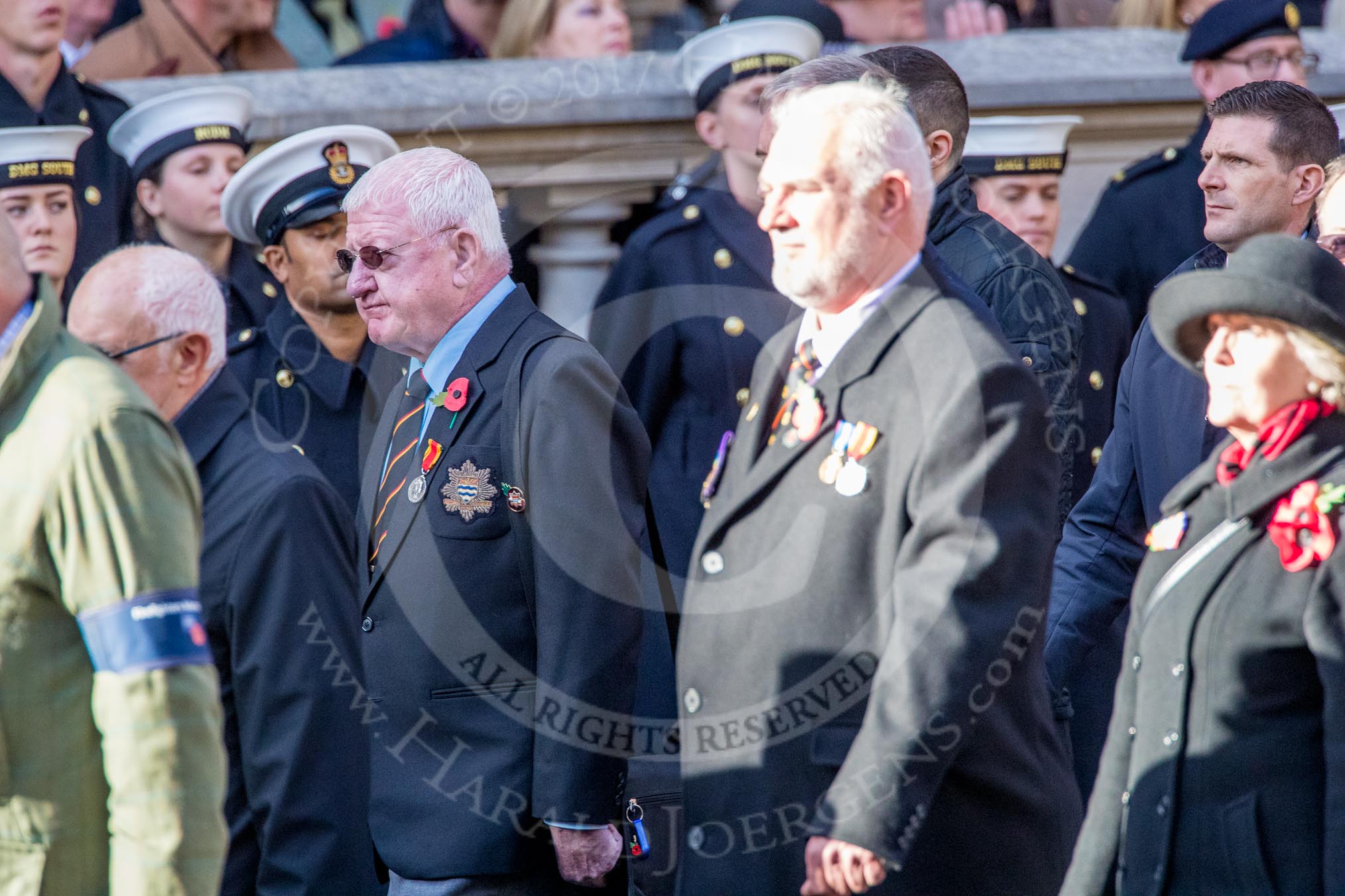 The Firefighters Memorial Trust (Group M16, 25 members) during the Royal British Legion March Past on Remembrance Sunday at the Cenotaph, Whitehall, Westminster, London, 11 November 2018, 12:26.