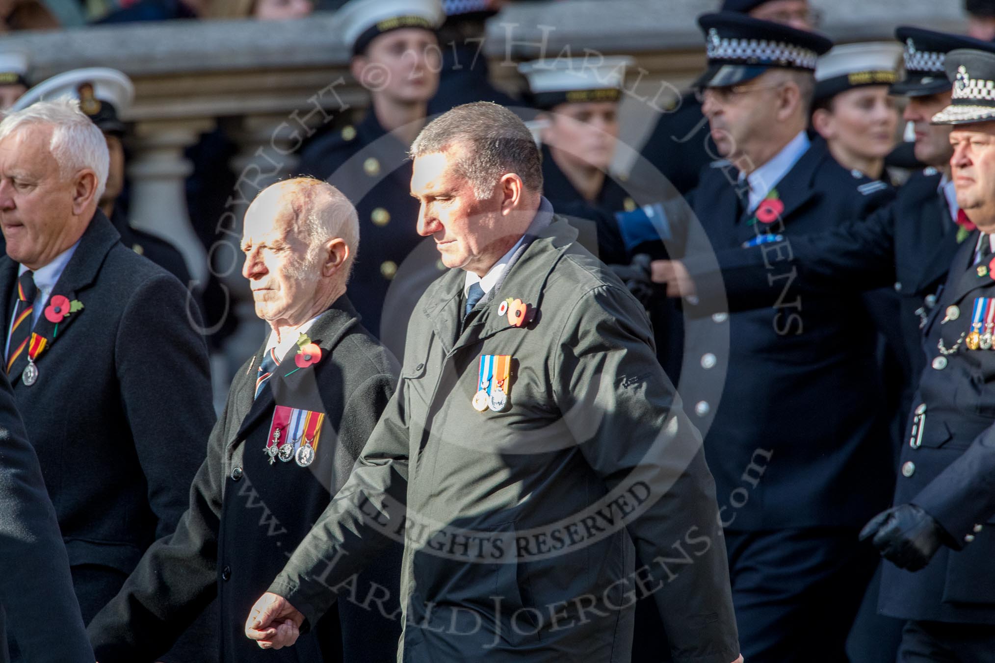 The Firefighters Memorial Trust (Group M16, 25 members) during the Royal British Legion March Past on Remembrance Sunday at the Cenotaph, Whitehall, Westminster, London, 11 November 2018, 12:26.