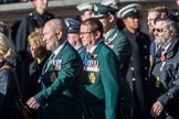 Fleet Air Arm Junglies Association  (Group E12, 22 members) during the Royal British Legion March Past on Remembrance Sunday at the Cenotaph, Whitehall, Westminster, London, 11 November 2018, 11:43.