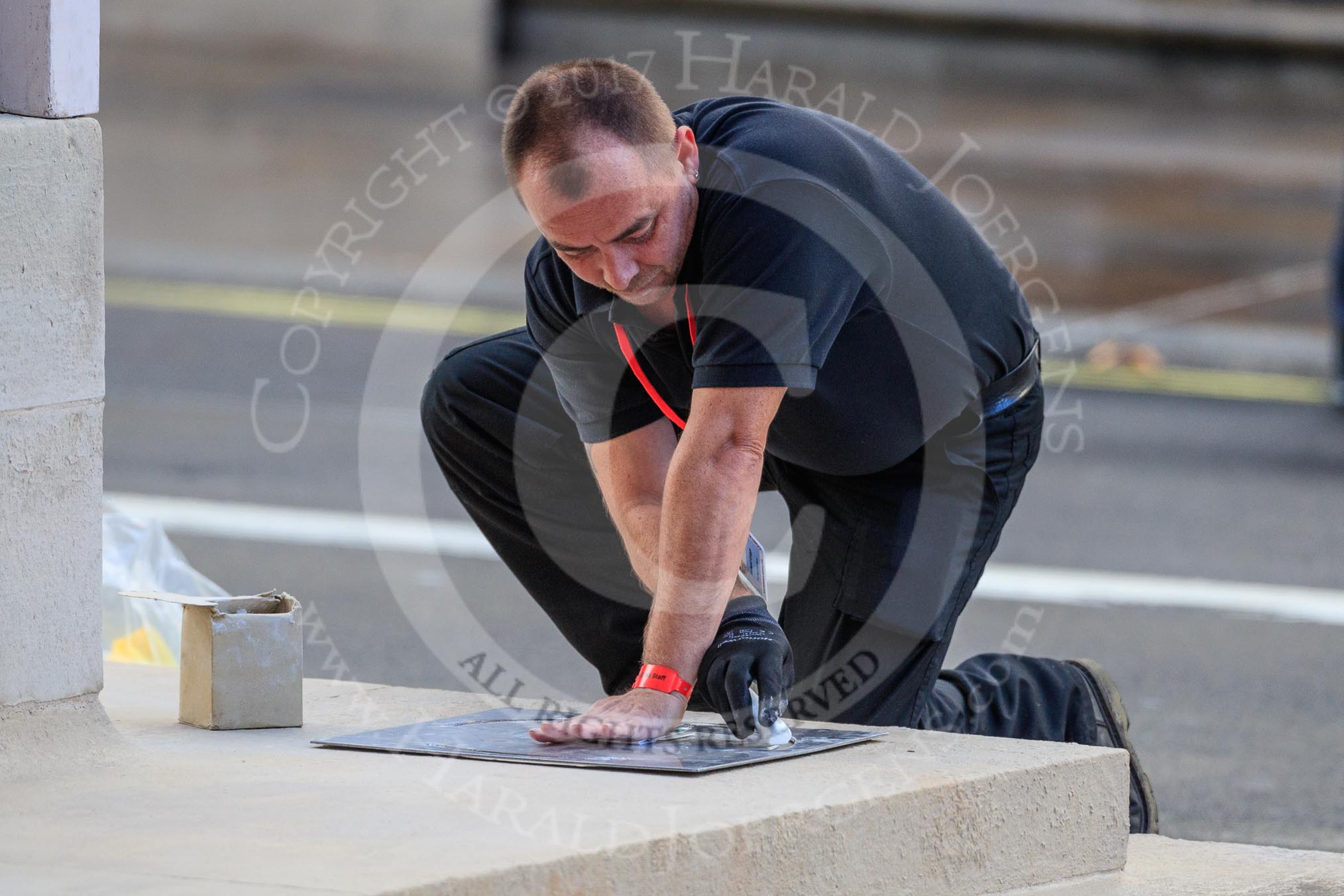 An Foreign and Commonwealth Office workman marking the position where the wreaths are to be laid around the Cenotaph before the Remembrance Sunday Cenotaph Ceremony 2018 at Horse Guards Parade, Westminster, London, 11 November 2018, 08:52.