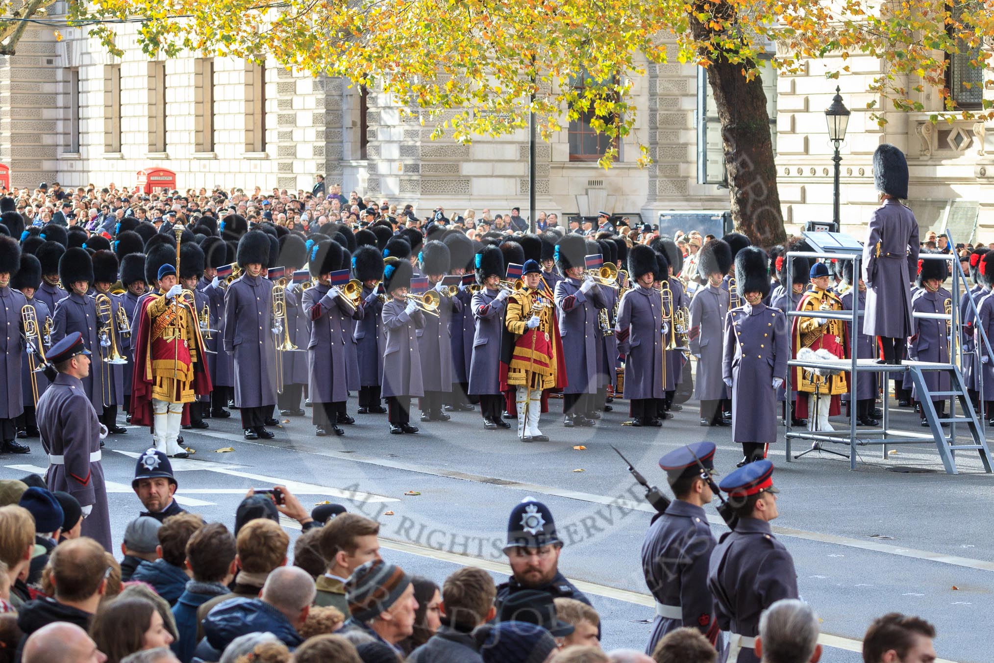 Three of the Massed Band are in position on Whitehall before the Remembrance Sunday Cenotaph Ceremony 2018 at Horse Guards Parade, Westminster, London, 11 November 2018, 10:28.