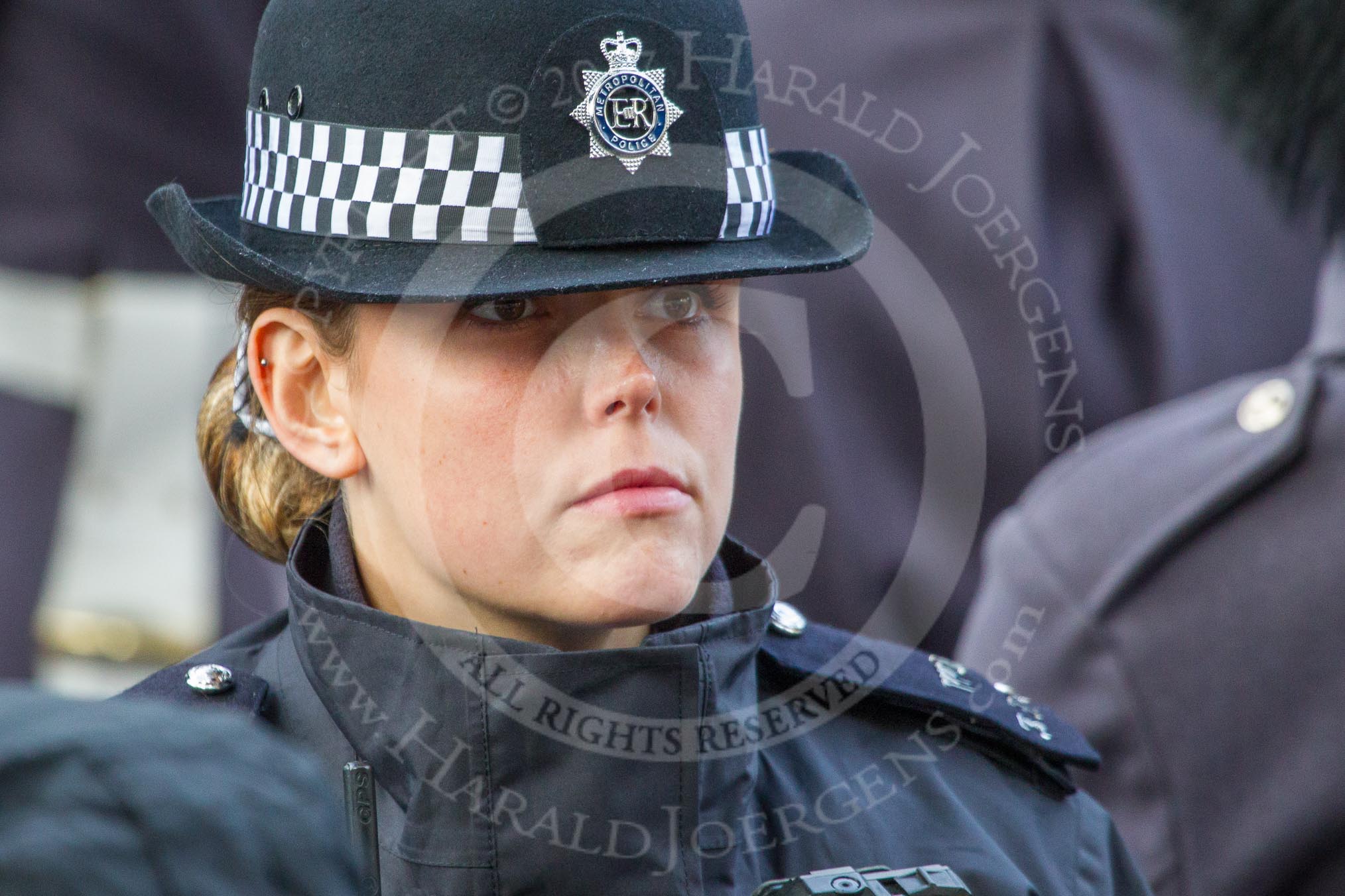 Metropolitan Police Constable Snell keeping an eye on the crowds before the Remembrance Sunday Cenotaph Ceremony 2018 at Horse Guards Parade, Westminster, London, 11 November 2018, 10:29.