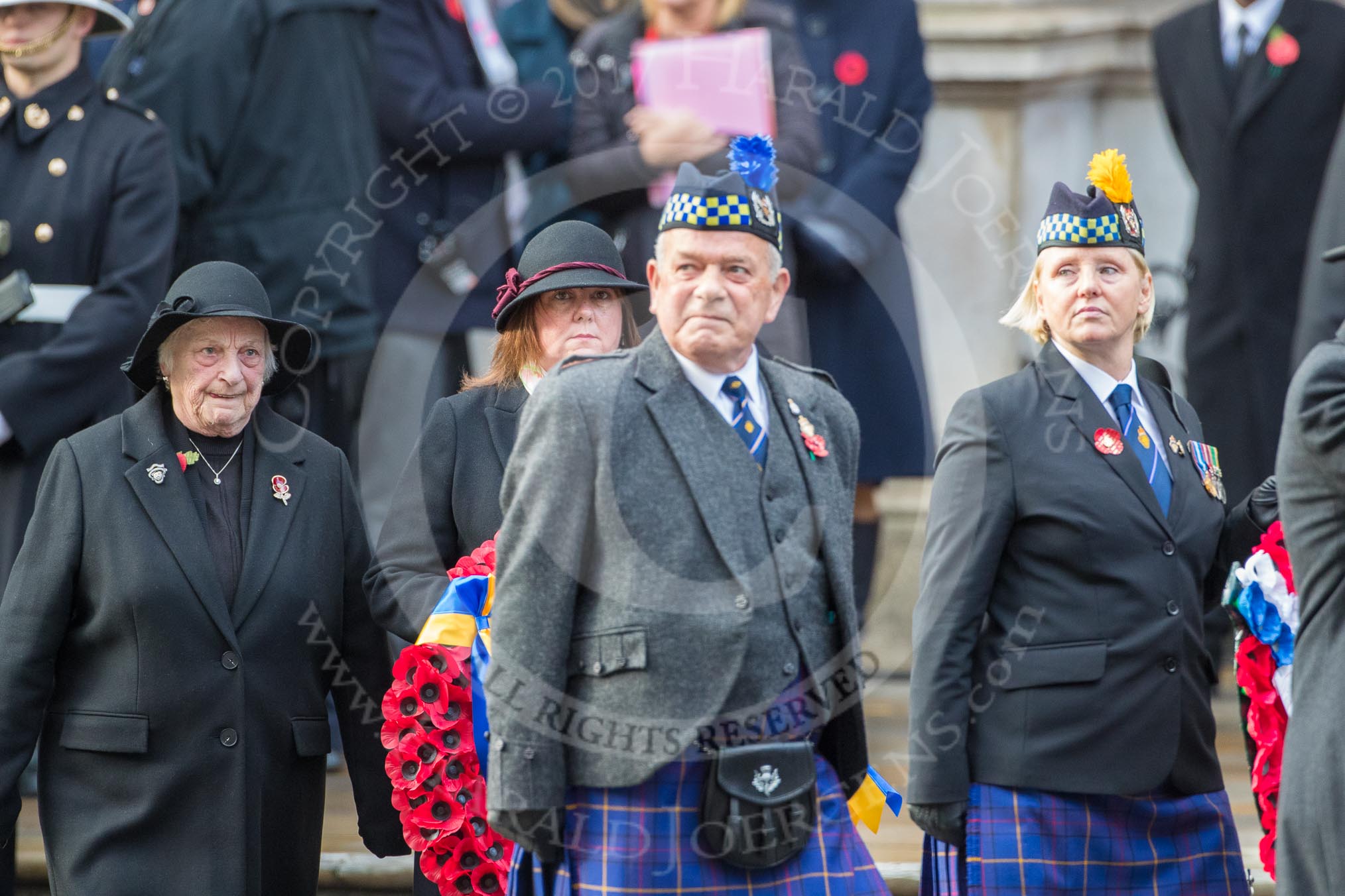 Representatives of The Royal British Legion, London Transport, the Royal Air Forces Association , the Royal Naval Association , the Royal Commonwealth Ex­Services League, the Royal British Legion Scotland, and the Royal British Legion Women’s Section leaving the Foreign and Commonwealth Office before the Remembrance Sunday Cenotaph Ceremony 2018 at Horse Guards Parade, Westminster, London, 11 November 2018, 10:35.