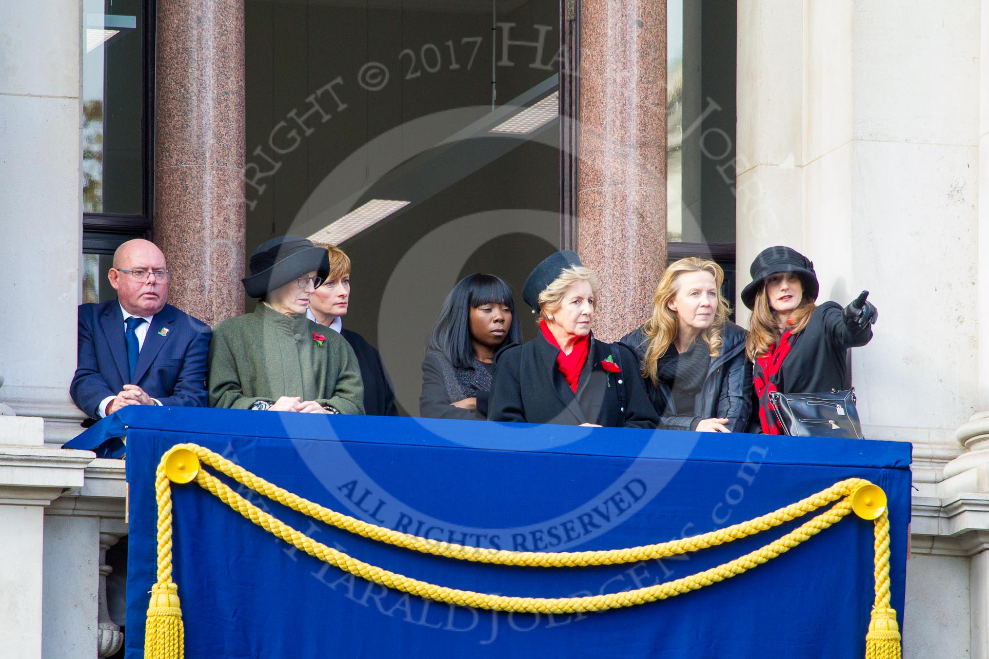 Guests on one of the eastern balconies of the Foreign and Commonwealth Office before the Remembrance Sunday Cenotaph Ceremony 2018 at Horse Guards Parade, Westminster, London, 11 November 2018, 10:43.