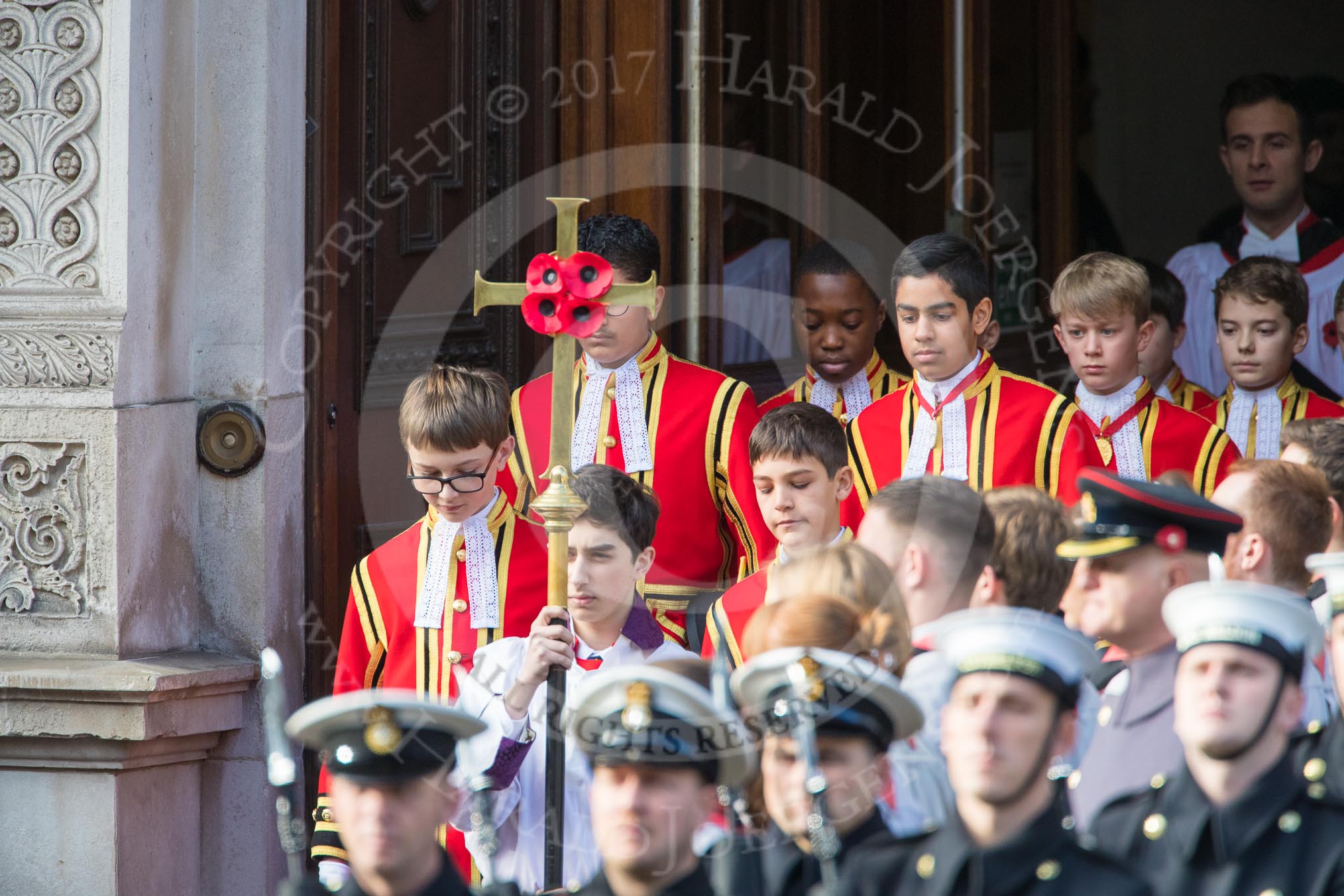 The Bishop’s Procession, here the the Choir, led by the Cross­Bearer, Michael Clayton Jolly, leaving the Foreign and Commonwealth Office during the Remembrance Sunday Cenotaph Ceremony 2018 at Horse Guards Parade, Westminster, London, 11 November 2018, 10:53.