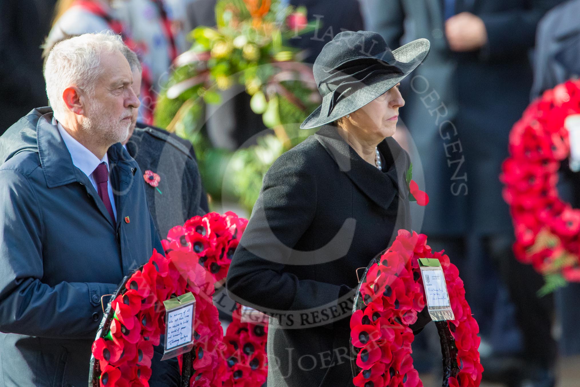 The Rt Hon Jeremy Corbyn MP, (Leader of the Labour Party and Leader of the Opposition)   and The Rt Hon Theresa May MP, Prime Minister, on behalf of the Government with their wreaths during the Remembrance Sunday Cenotaph Ceremony 2018 at Horse Guards Parade, Westminster, London, 11 November 2018, 10:55.