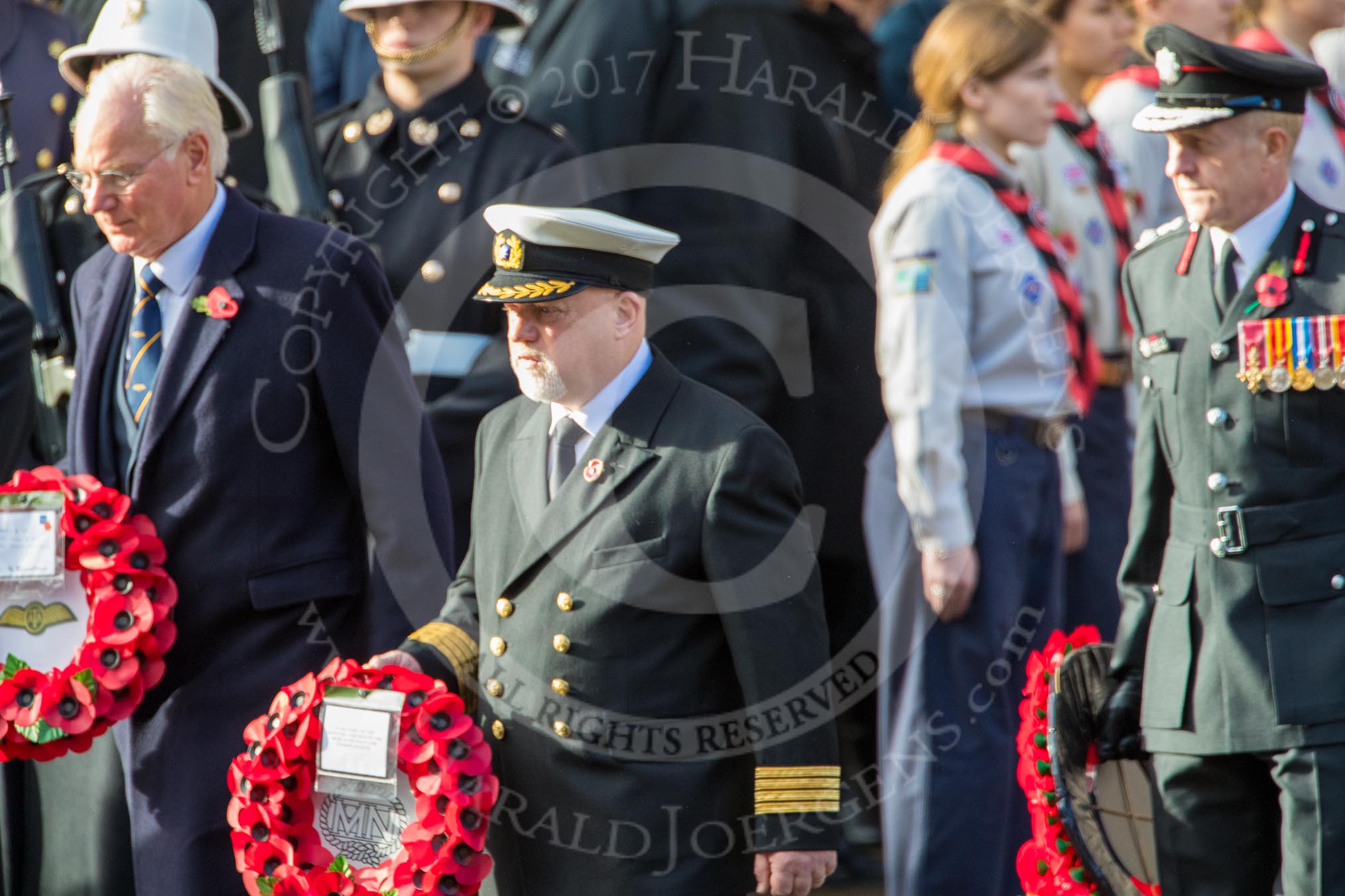 Mr Christopher Garrod, Air Transport Auxiliary Association , Captain David Johnstone, Merchant Navy, and General Mark Carleton­Smith OBE, Chief of the General Staff (?) with their wreaths at the Cenotaph during the Remembrance Sunday Cenotaph Ceremony 2018 at Horse Guards Parade, Westminster, London, 11 November 2018, 10:55.