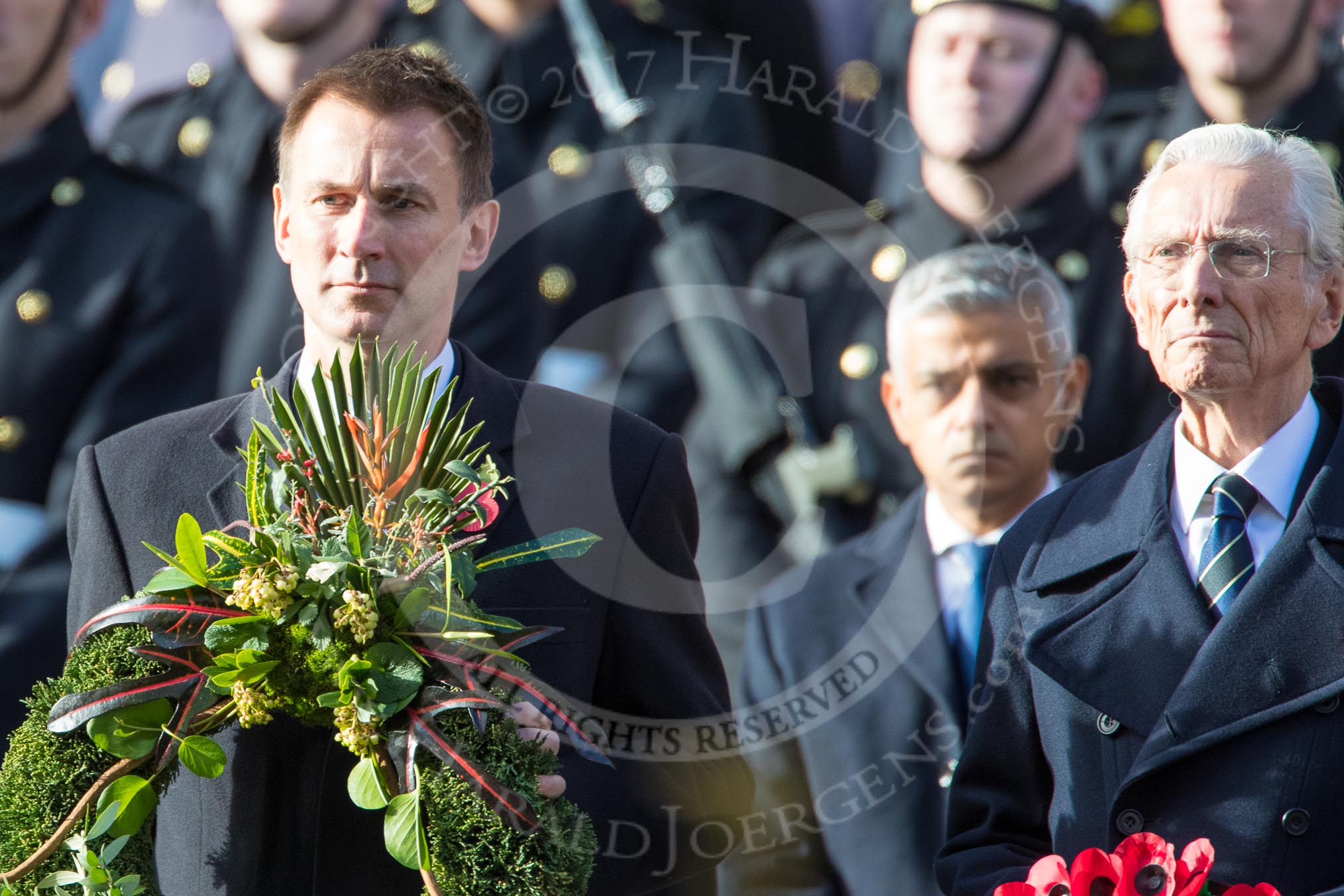 The Rt Hon Jeremy Hunt MP, Secretary of State for Foreign and Commonwealth Affairs, on behalf of the United Kingdom Overseas Territories and The Rt Hon The Lord Fowler, Lord Speaker, (on behalf of Parliament representing members of the House of Lords)   with their wreaths during the Remembrance Sunday Cenotaph Ceremony 2018 at Horse Guards Parade, Westminster, London, 11 November 2018, 10:57.