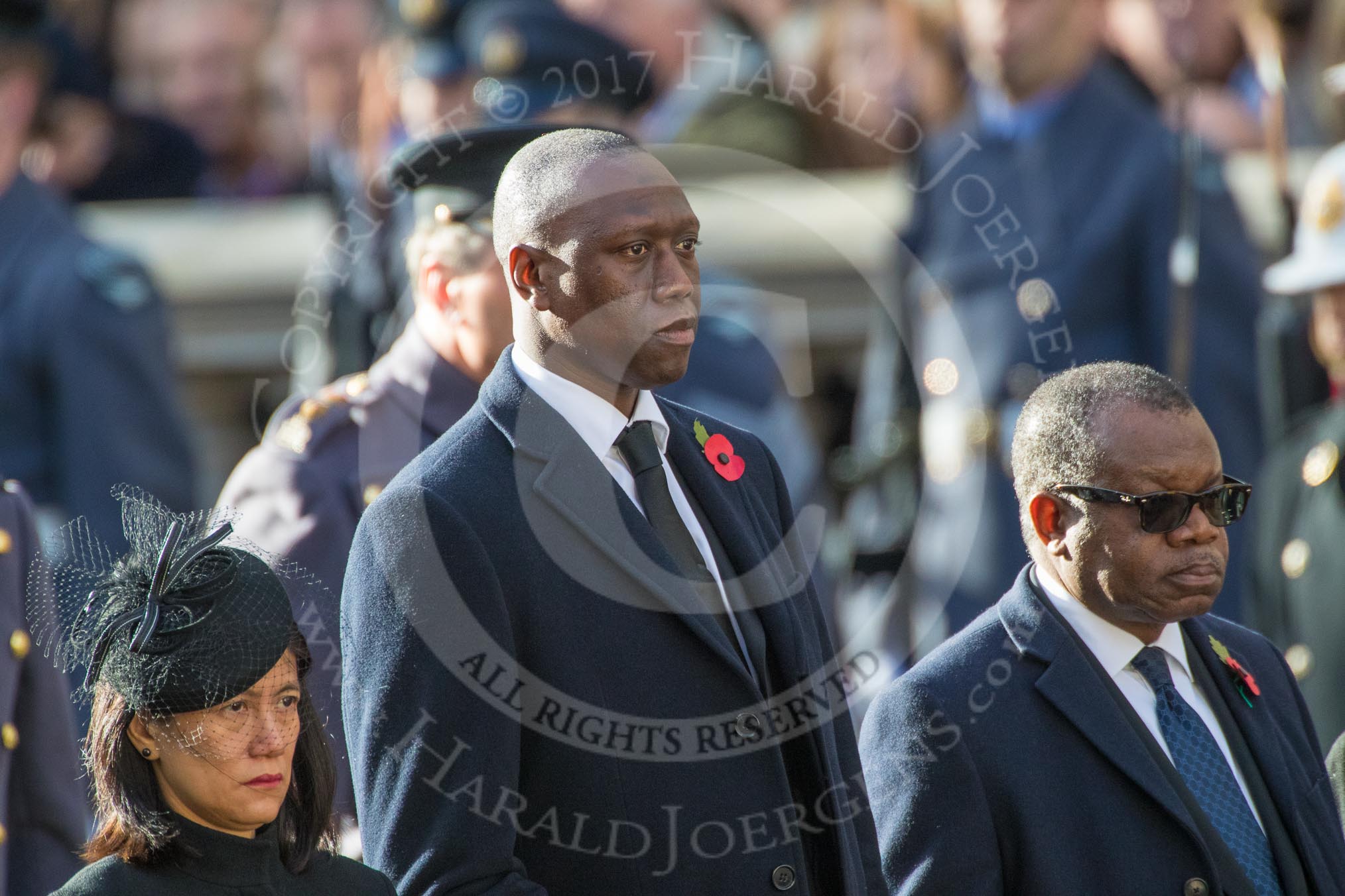 The High Commissioner of Singapore, Ms Foo Chi Hsia, the The Deputy Head of Mission of The Gambia, Mr. Kalifa Bojang, and the The High Commissioner of Zambia, H.E. Muyeba Shichapwa Chikonde, during Remembrance Sunday Cenotaph Ceremony 2018 at Horse Guards Parade, Westminster, London, 11 November 2018, 11:03.