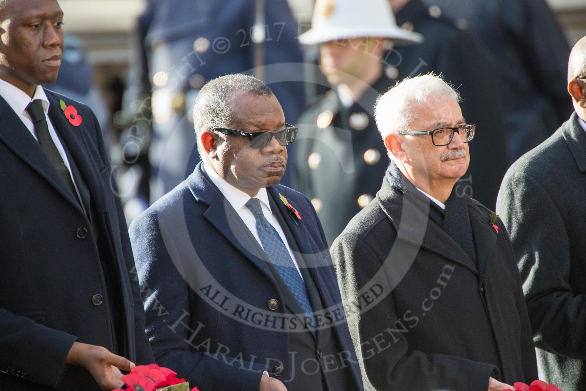 The Deputy Head of Mission of The Gambia, Mr. Kalifa Bojang, the The High Commissioner of Zambia, H.E. Muyeba Shichapwa Chikonde, and the The High Commissioner of Malta, Joseph Cole, during Remembrance Sunday Cenotaph Ceremony 2018 at Horse Guards Parade, Westminster, London, 11 November 2018, 11:04.