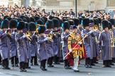 The third of the Massed Bands, the Band of the Irish Guards, led by Senior Drum Major Household Division, Damian Thomas, Grenadier Guards,  arrives on Whitehall before the Remembrance Sunday Cenotaph Ceremony 2018 at Horse Guards Parade, Westminster, London, 11 November 2018, 10:27.