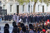 The first groups of the March Past are in place near Downing Street corner on Whitehall before the Remembrance Sunday Cenotaph Ceremony 2018 at Horse Guards Parade, Westminster, London, 11 November 2018, 10:30. In front the Service detachment from the King's Troop Royal Horse Artillery and Service detachment from the Household Cavalry.