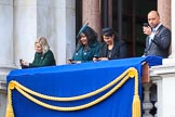 Early guests on one of the balconies of the Foreign and Commonwealth Office fiddling with their mobile phones before the Remembrance Sunday Cenotaph Ceremony 2018 at Horse Guards Parade, Westminster, London, 11 November 2018, 10:32.