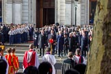 Whitehall, with the choir and cross bearer opposite the government during the Remembrance Sunday Cenotaph Ceremony 2018 at Horse Guards Parade, Westminster, London, 11 November 2018, 11:12.