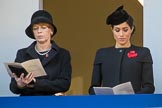 Mrs. Elke Büdenbender, wife of HE The President of the Federal Republic of Germany, Frank-Walter Steinmeier and HRH The Duchess of Sussex (Meghan), singing, on the balcony of the Foreign and Commonwealth Office during the Remembrance Sunday Cenotaph Ceremony 2018 at Horse Guards Parade, Westminster, London, 11 November 2018, 11:18.