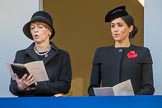 Mrs. Elke Büdenbender, wife of HE The President of the Federal Republic of Germany, Frank-Walter Steinmeier and HRH The Duchess of Sussex (Meghan), singing, on the balcony of the Foreign and Commonwealth Office during the Remembrance Sunday Cenotaph Ceremony 2018 at Horse Guards Parade, Westminster, London, 11 November 2018, 11:19.