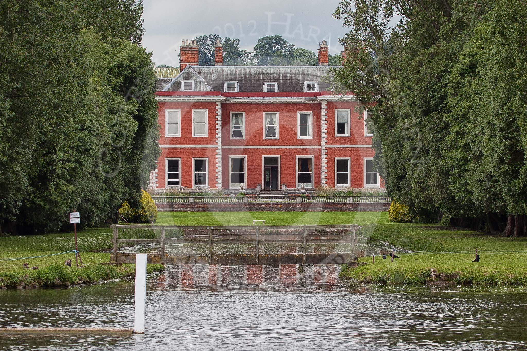 Henley Royal Regatta 2012 (Monday): Fawley Court, designed by Christopher Wren, with gardens landscaped by Lancelot 'Capability' Brown..
River Thames beteen Henley-on-Thames and Remenham/Temple Island ,
Henley-on-Thames,
Oxfordshire,
United Kingdom,
on 25 June 2012 at 12:06, image #15