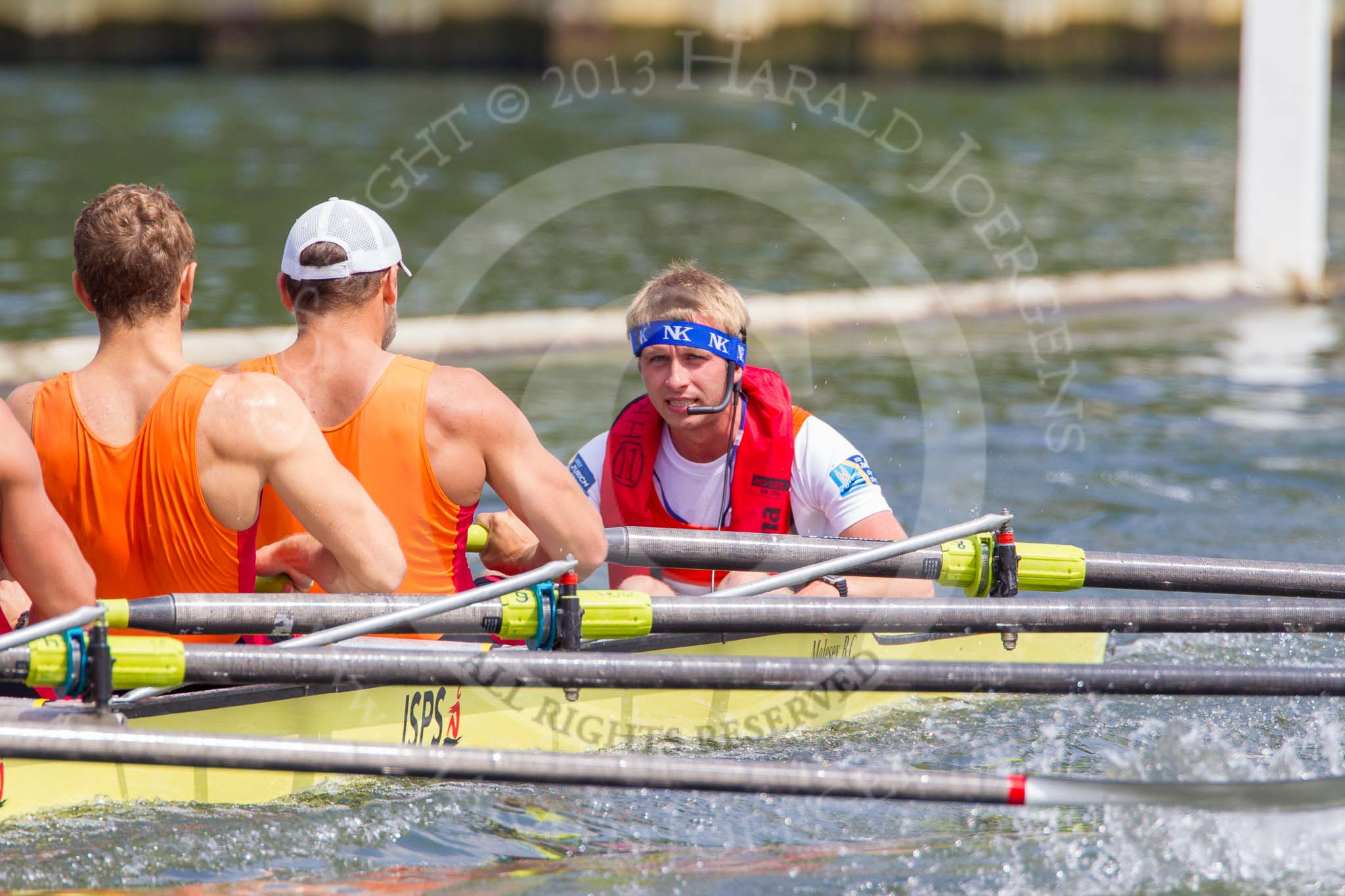 Henley Royal Regatta 2013, Saturday: Race No. 12 for the Temple Challenge Cup, St. Petersburg University, Russia (orage), v Delftsche Studenten Roeivereeninging Laga, Holland (red), here St. Petersburg cox A. Barkarov. Image #250, 06 July 2013 11:51 River Thames, Henley on Thames, UK