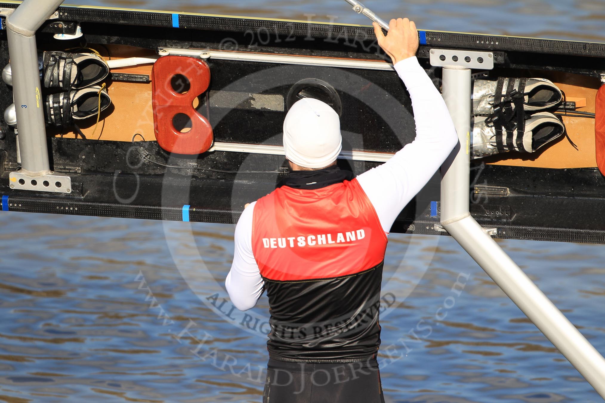 The Boat Race season 2012 - fixture OUBC vs German U23: 3 seat in the German U23 boat - Robin Ponte, getting the boat ready..
River Thames between Putney and Mortlake,
London,

United Kingdom,
on 26 February 2012 at 14:45, image #8