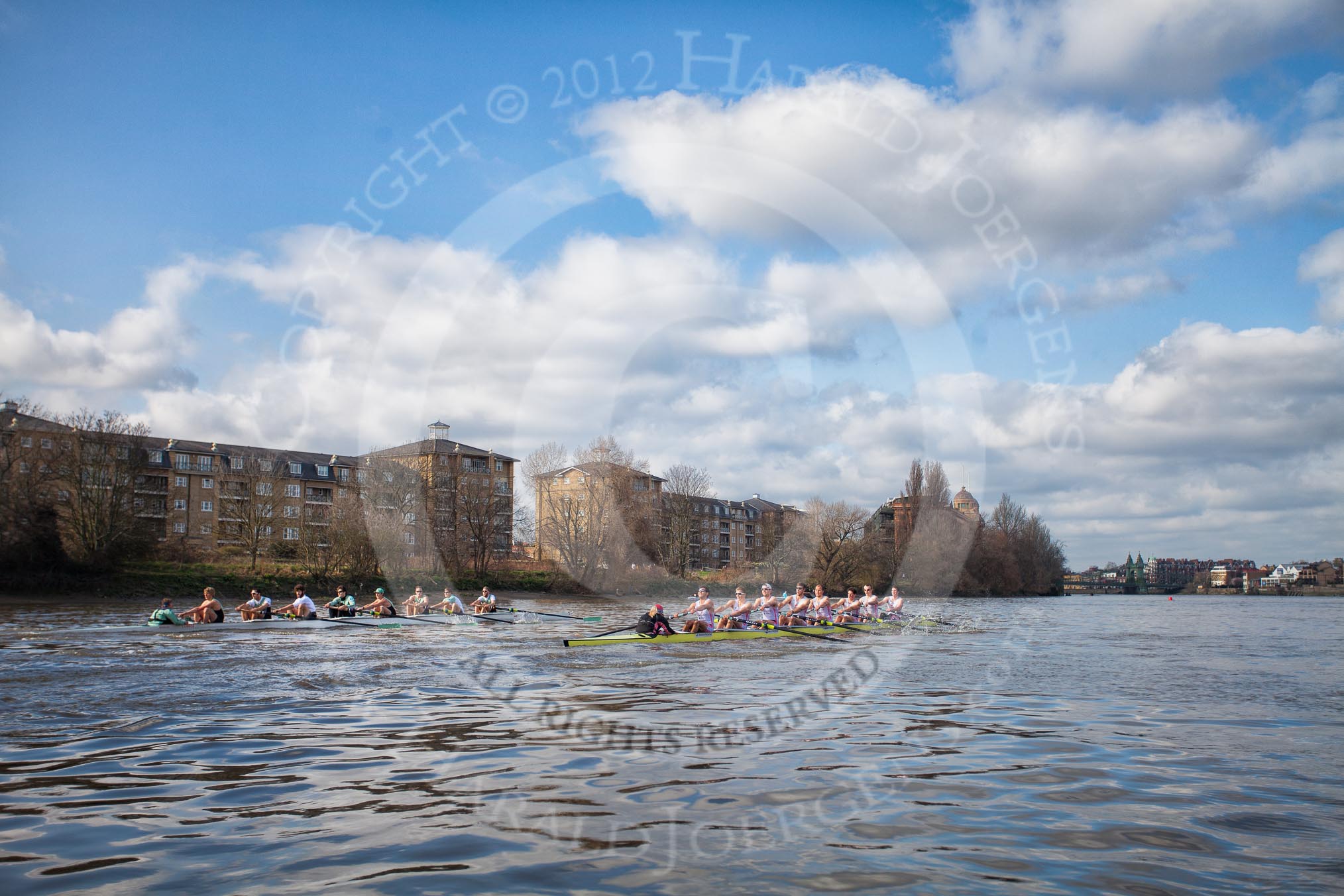 The Boat Race season 2012 - fixture CUBC vs Leander: CUBC (left) and Leander Club Eight reaching the Mile Post on the way to the Surrey Bend, with Hammersmith Bridge in the background. On the left Handel Mansions and Holst Mansions, followed by the Harrods Depository..
River Thames between Putney and Molesey,
London,
Greater London,
United Kingdom,
on 10 March 2012 at 14:17, image #127
