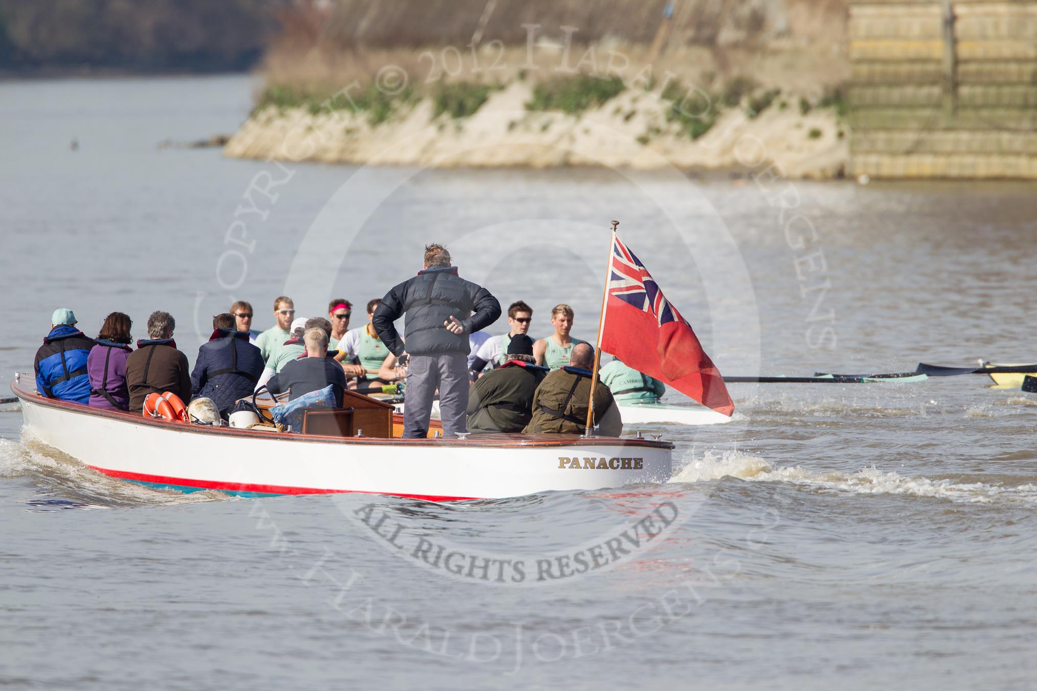 The Boat Race season 2012 - fixture CUBC vs Molesey BC: The CUBC Blue Boat nearly hidden behind a launch of officials. On the very right the bow of the Molesey BC boat they are racing..




on 25 March 2012 at 15:19, image #130