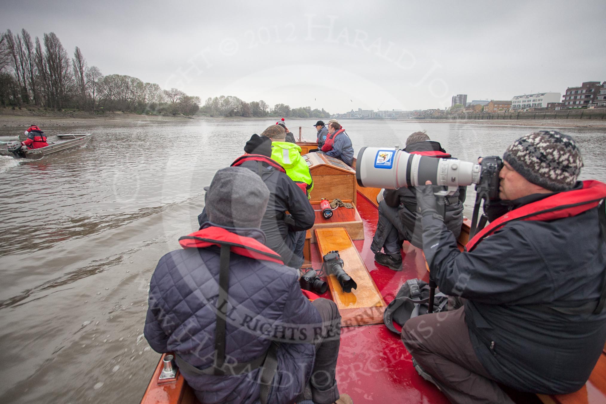 A press launch on the River Thames between Putney Bridge and Hammersmith Bridge, following the Cambridge University Boat Club Blue Boat and the Cambridge chief coach Steve Trapmore.