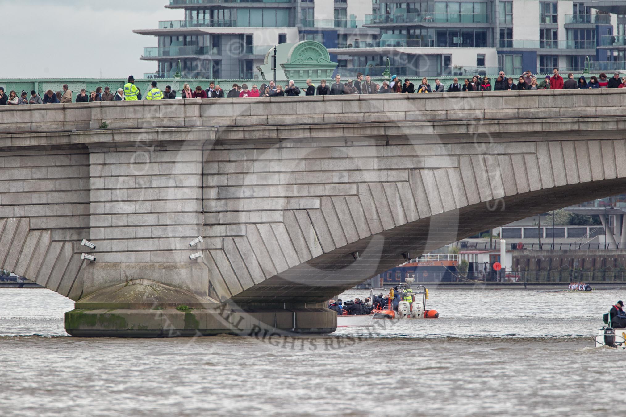 The Boat Race 2012: Minutes before the start of the 2012 Boat Race. The Oxford Blue Boat is holding back, on the right side of the image, behind a Putney Bridge that's packed with spectators..




on 07 April 2012 at 13:54, image #200