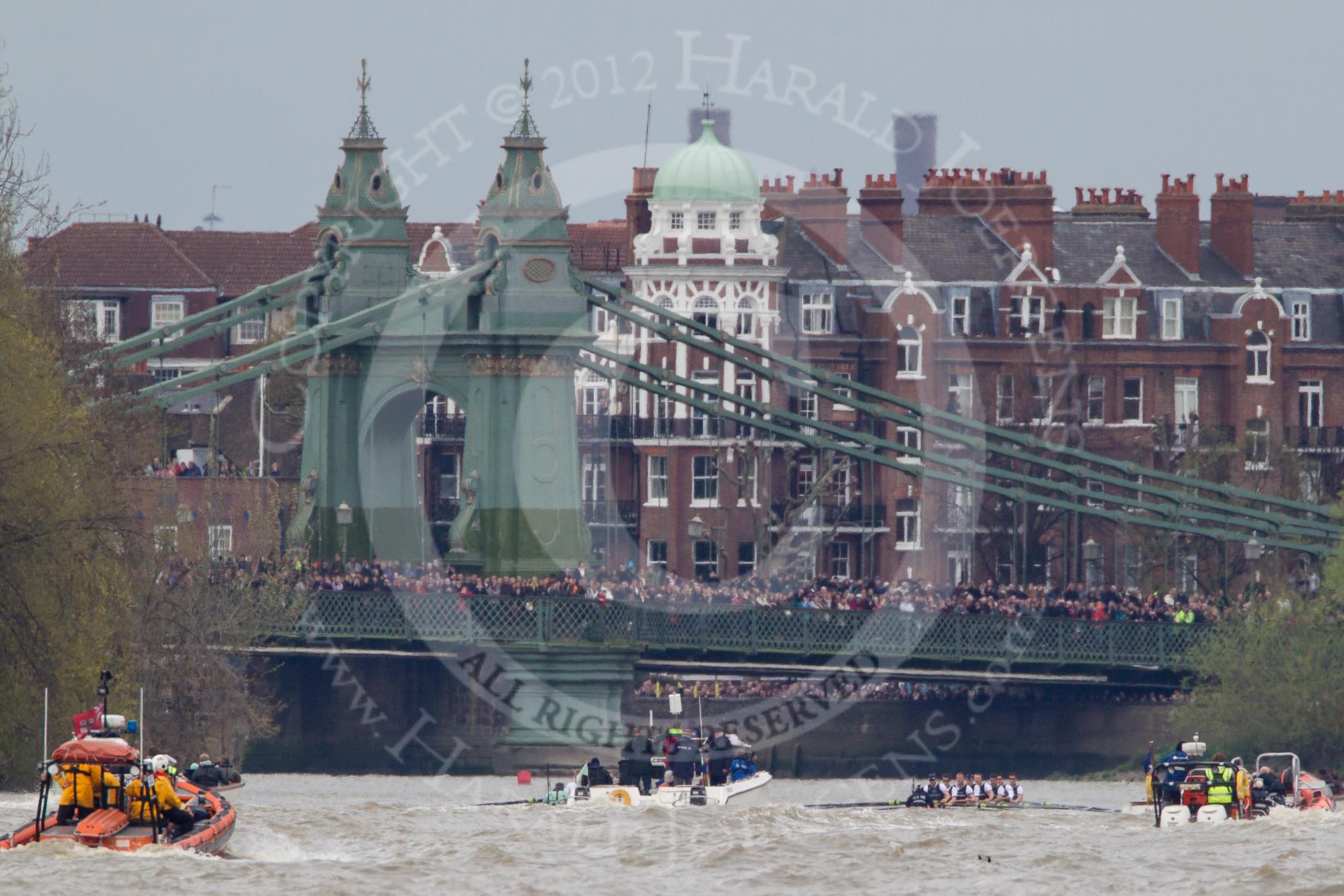The Boat Race 2012: The 2012 Boat Race, with the boats approaching Hammersmith Bridge: The Cambridge Blue Boat on the left, nearly covered by the boat of the umpire, and the Oxford Blue Boat on the right..




on 07 April 2012 at 14:20, image #300