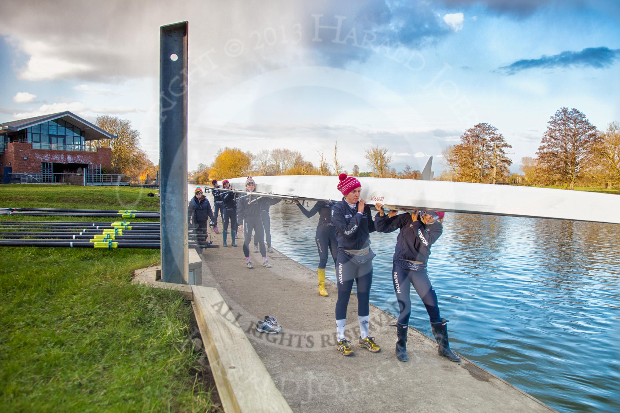 The Boat Race season 2013 - OUWBC training: The OUWBC Blue Boat squad getting ready at Fleming Boathouse - bow Mariann Novak, Alice Carrington-Windo, Mary Foord-Weston, Jo Lee, Amy Varney, Harriet Keane, Anastasia Chitty, stroke Maxie Scheske, and cox Katie Apfelbaum on the left..
Fleming Boathouse,
Wallingford,
Oxfordshire,
United Kingdom,
on 13 March 2013 at 16:49, image #16