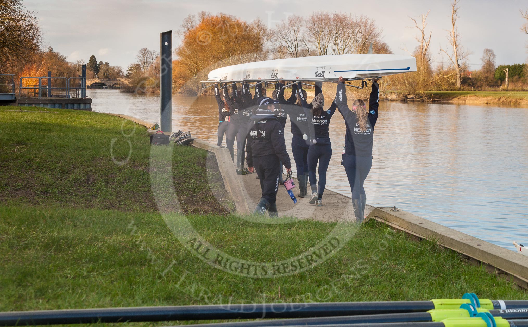 The Boat Race season 2013 - OUWBC training: The crew of the OUWBC reserve boat Osiris getting ready for training at Fleming Boathouse: bow Coralie Viollet-Djelassi, Elspeth Cumber, Hannah Ledbury, Eleanor Darlington, Rachel Purkess, Caitlin Goss, Annika Bruger, stroke Emily Chittock, and cox Sophie Shawdon..
Fleming Boathouse,
Wallingford,
Oxfordshire,
United Kingdom,
on 13 March 2013 at 16:50, image #22