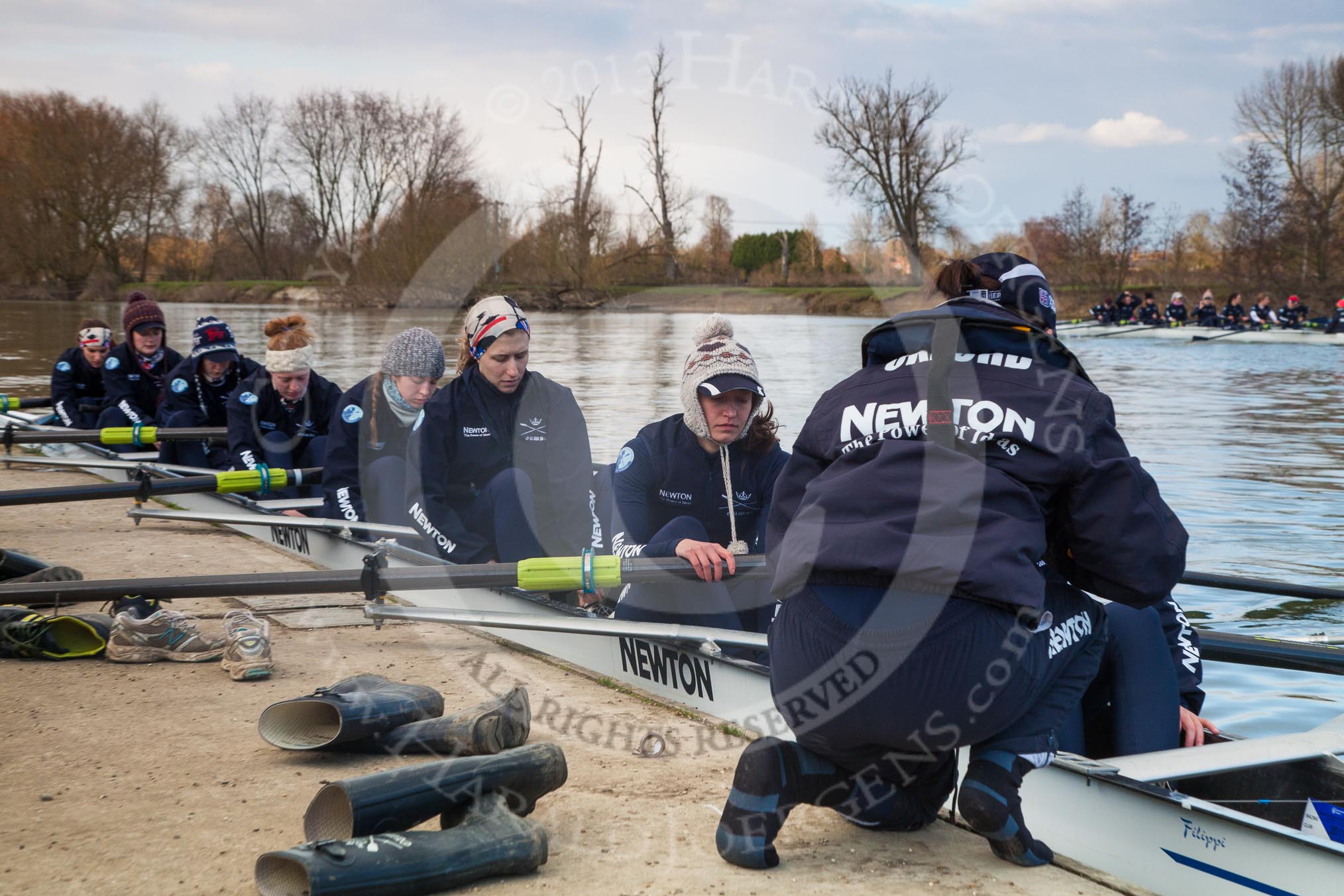 The Boat Race season 2013 - OUWBC training: The crew of Osiris, the OUWBC reserve boat, getting ready: Cox Sophie Shawdon, stroke Emily Chittock, then Annika Bruger, Caitlin Goss, Rachel Purkess, Eleanor Darlington, Hannah Ledbury, Elspeth Cumber,  and bow Coralie Viollet-Djelassi..
Fleming Boathouse,
Wallingford,
Oxfordshire,
United Kingdom,
on 13 March 2013 at 16:52, image #31