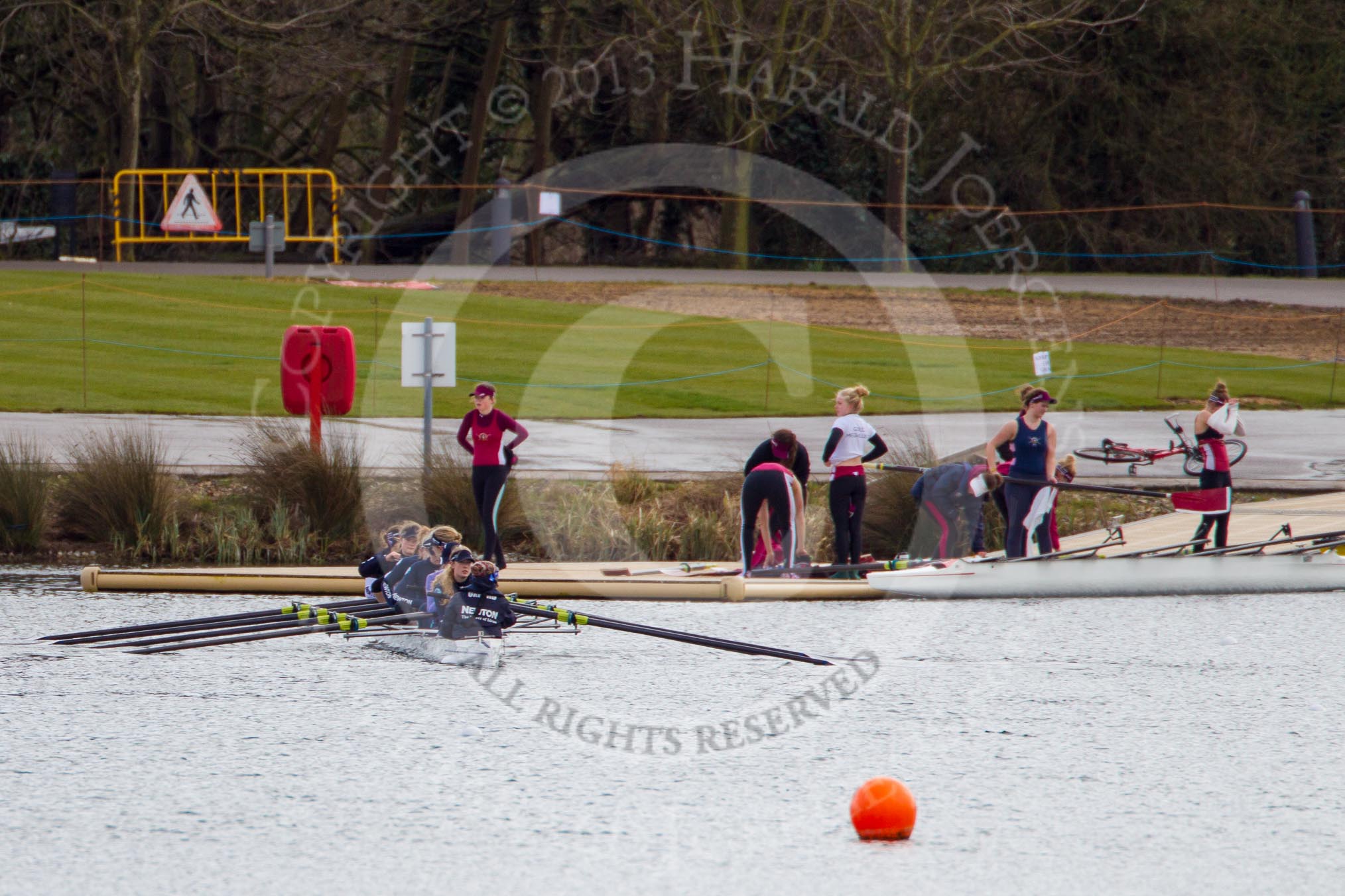 The Boat Race season 2013 - fixture OUWBC vs Olympians: The OUWBC reserve boat Osiris returning to a pontoon an Dorney Lake after the training session whilst the Olympians are carrying their boat away..
Dorney Lake,
Dorney, Windsor,
Buckinghamshire,
United Kingdom,
on 16 March 2013 at 12:32, image #331