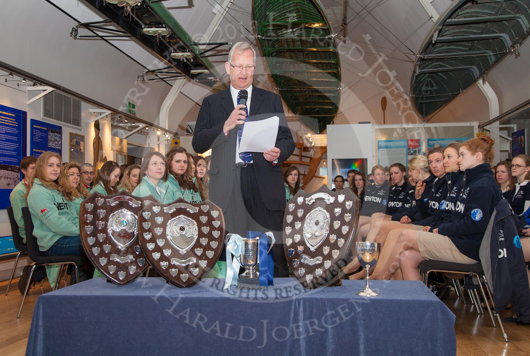 The Boat Race Season 2013 - Henley Boat Races Challenge: Leander Club's Robert Treharne Jones, the "Voice of Rowing", as master of ceremonies at the Henley Boat Races Challenge. In front of him the Henley Boat Races trophies..
River and Rowing Museum,
H,


on 19 March 2013 at 11:01, image #15