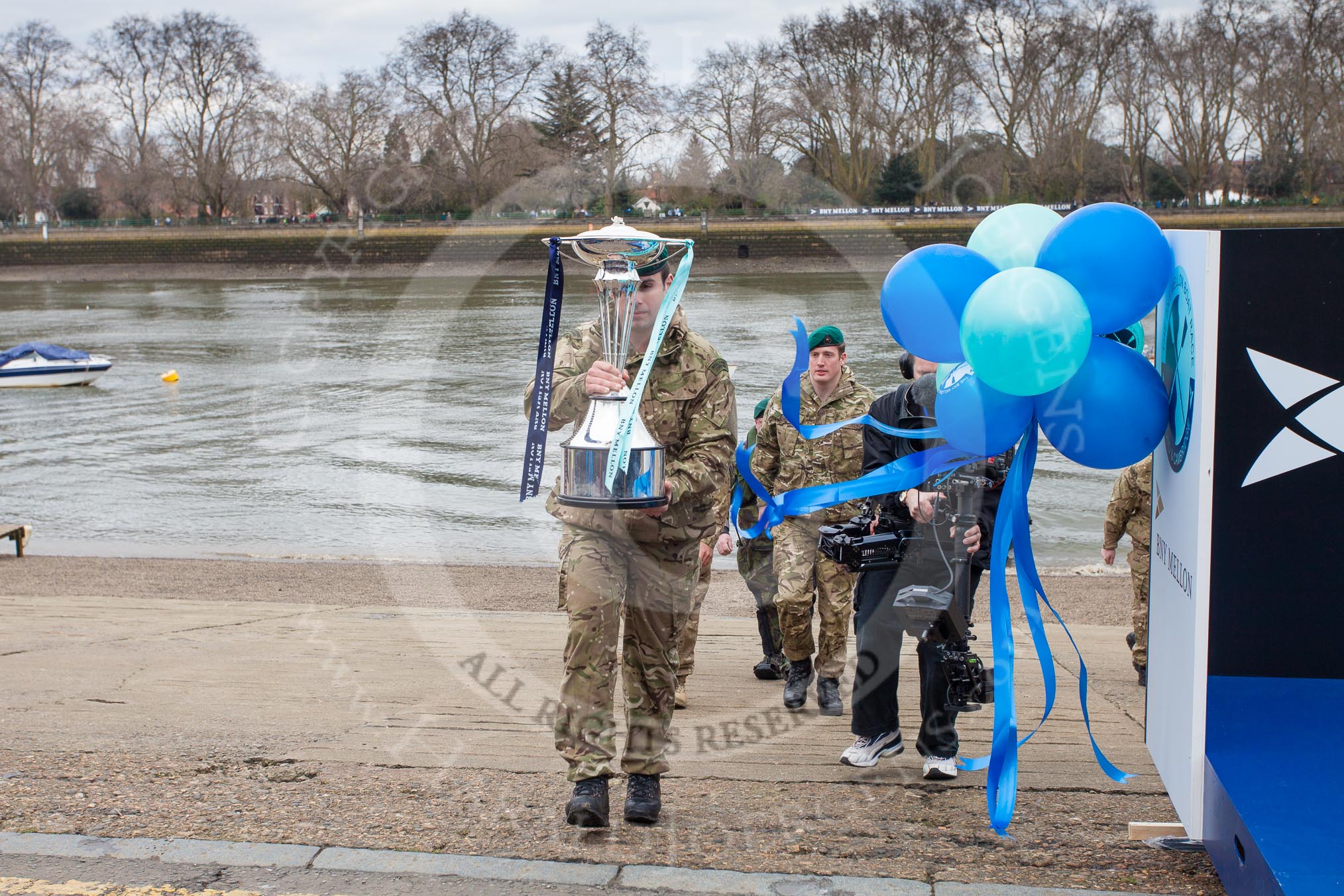 The Boat Race 2013: The 2013 Boat Race trophy is delivered by Royal Marines and closely wached by a BBC steadicam..
Putney,
London SW15,

United Kingdom,
on 31 March 2013 at 14:14, image #68