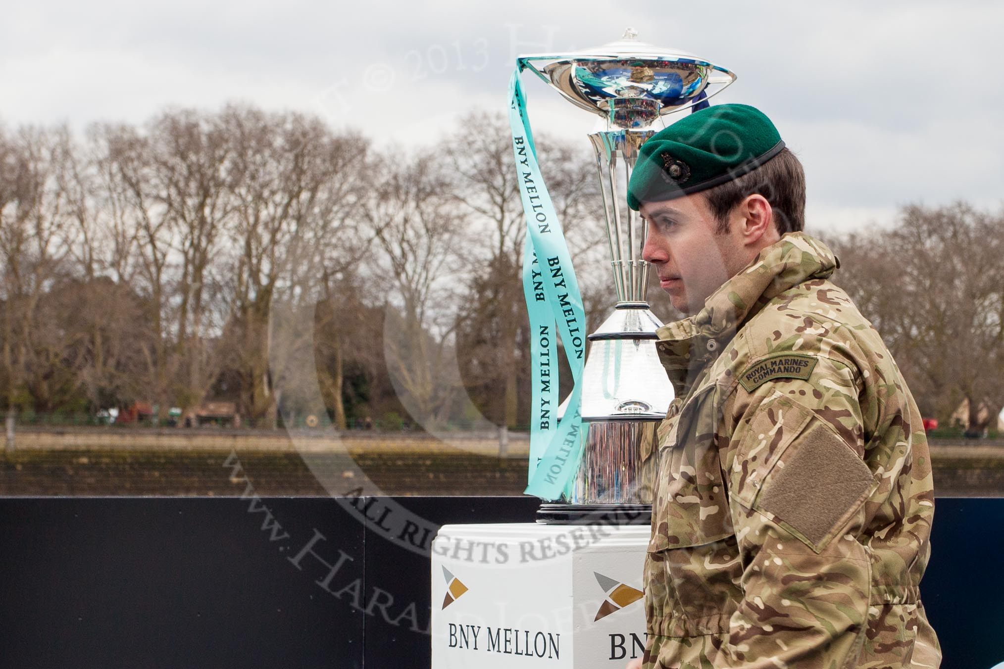 The Boat Race 2013: The 2013 Boat Race trophy is put on a stand, by a member of a Royal Marines commando, for the following toss of the coin between the Oxford and Cambridge teams..
Putney,
London SW15,

United Kingdom,
on 31 March 2013 at 14:14, image #70