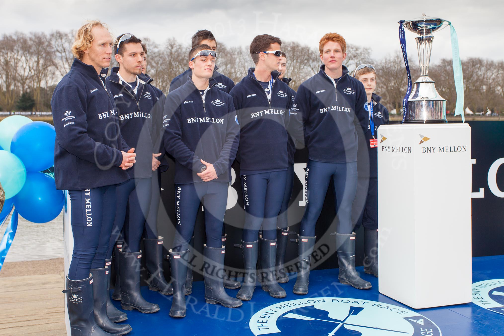 The Boat Race 2013: The crew of the Oxford reserve boat Isis before the toss for stations - 7 seat Rev'd James Stephenson, 4 William Zeng, 3 Dr Alexander Woods, stroke Thomas Watson, 2 Nicholas Hazell, 6 Benjamin French, bow Iain Mandale, 5 Joseph Dawson and cox Laurence Harvey..
Putney,
London SW15,

United Kingdom,
on 31 March 2013 at 14:33, image #81
