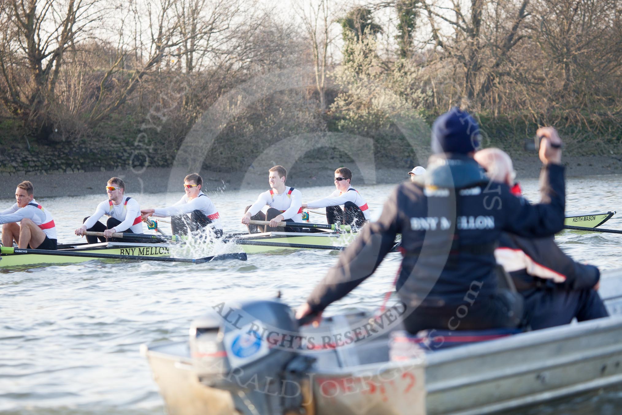 The Boat Race season 2014 - fixture OUBC vs German U23: The German U23-boat seen behind the tin boat with Oxford coach Sean Bowden..
River Thames between Putney Bridge and Chiswick Bridge,



on 08 March 2014 at 16:50, image #98