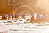 The Boat Race season 2014 - fixture OUBC vs German U23: The OUBC boat, on the left, and the German U23 boat during the second race between Barnes Railway Bridge and the finish line at Chiswick Bridge, shot against  the evening sun..
River Thames between Putney Bridge and Chiswick Bridge,



on 08 March 2014 at 17:09, image #252