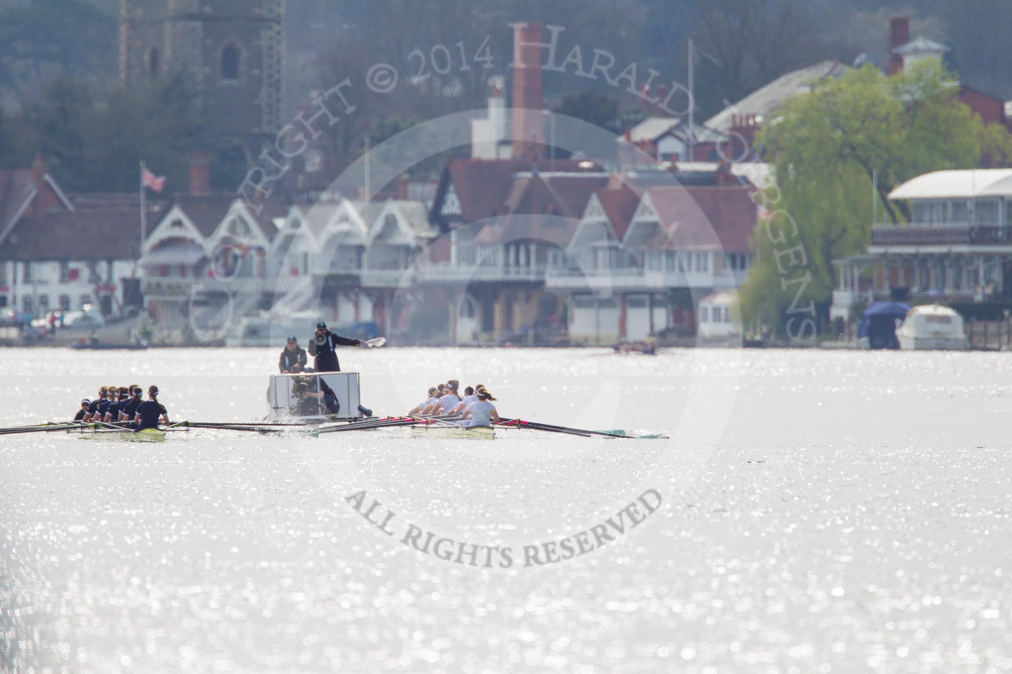 The Women's Boat Race and Henley Boat Races 2014: The Women's Reserves - Osiris v. Blondie race. Osiris (Oxford) on the left,  and Blondie (Cambridge) are getting close enough to be warned by the race umpire..
River Thames,
Henley-on-Thames,
Buckinghamshire,
United Kingdom,
on 30 March 2014 at 14:15, image #137