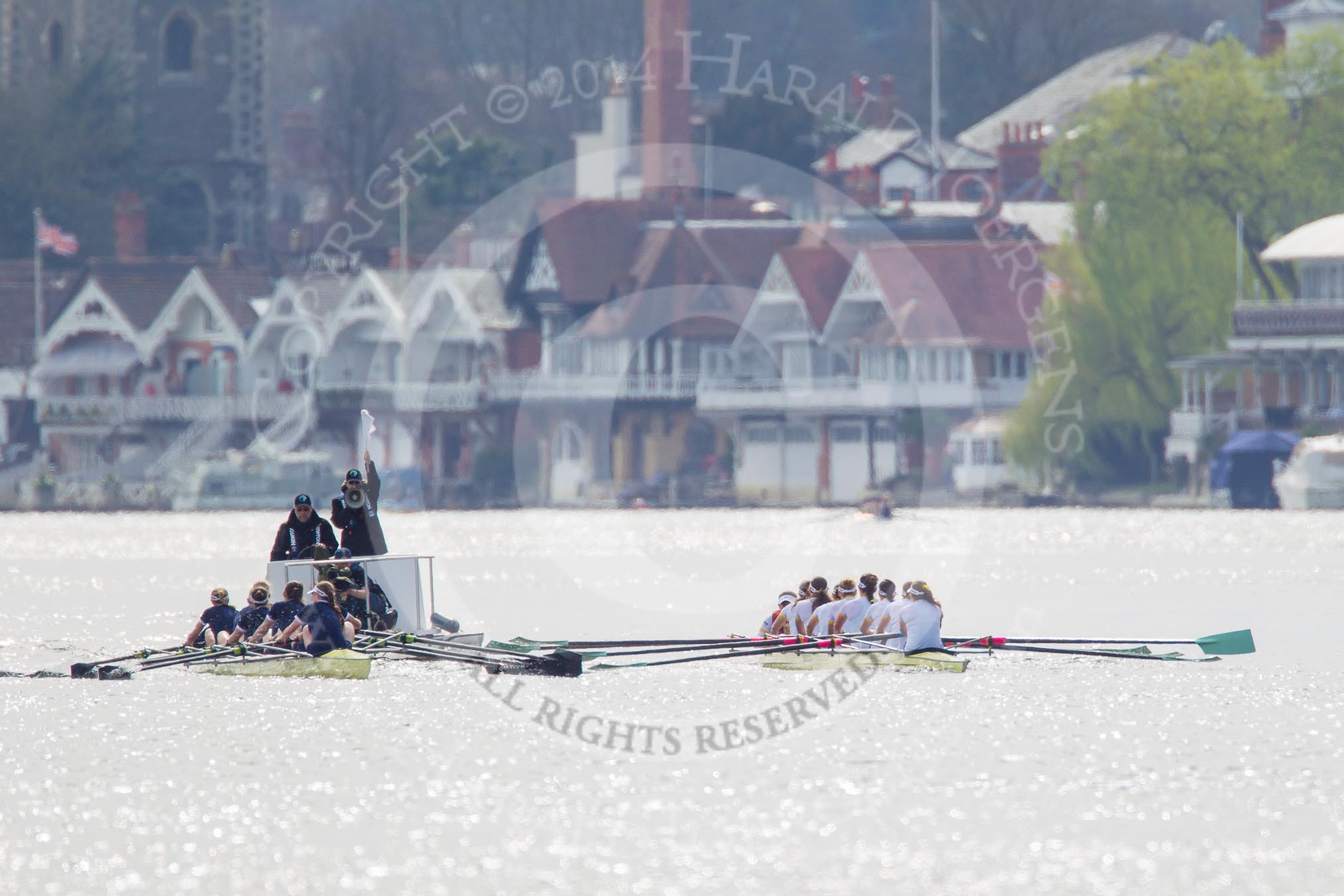 The Women's Boat Race and Henley Boat Races 2014: The Women's Reserves - Osiris v. Blondie race. Osiris (Oxford) on the left,  and Blondie (Cambridge) are getting close enough to be warned by the race umpire..
River Thames,
Henley-on-Thames,
Buckinghamshire,
United Kingdom,
on 30 March 2014 at 14:15, image #139